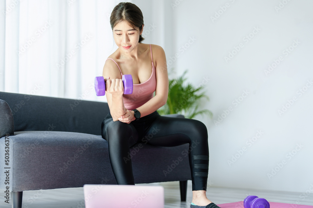 stress relief, , breathing exercises, meditation, portrait of Asian healthy woman lifting weights to strengthen her muscles after work.