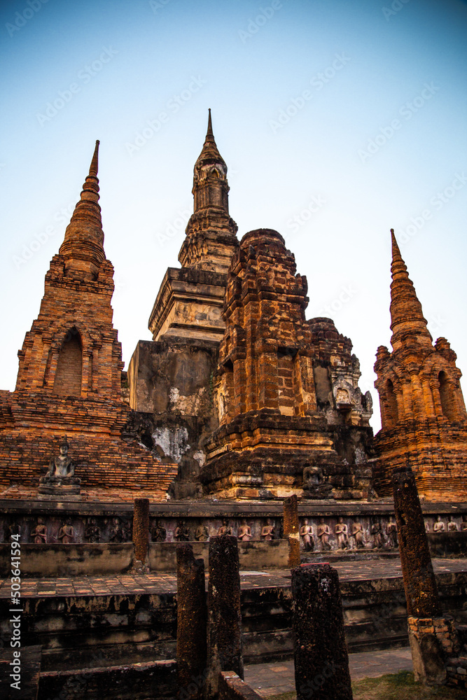 Sunset at Wat Mahathat buddha and temple in Sukhothai Historical Park Sunset at Wat Mahathat buddha and temple in Sukhothai Historical Park