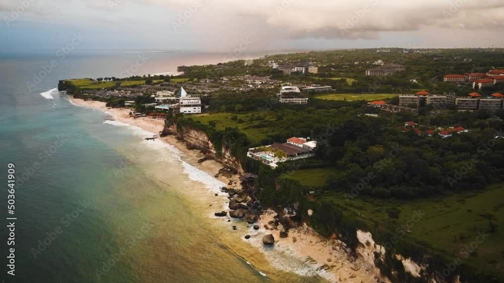 Beautiful Bingin beach with exotic cliffs houses and hotel located in Bali, Indonesia. This drone footage was shot during Sunset time. Beautiful Bingin beach with exotic cliffs houses and hotel located in Bali, Indonesia. This drone footage was shot during Sunset time.