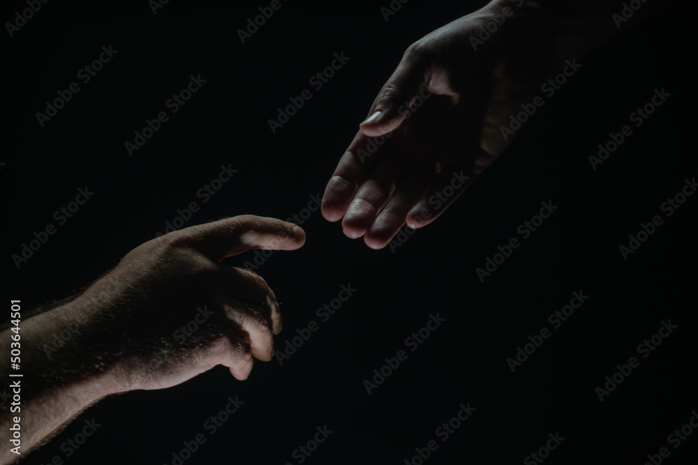 Men holding hands isolated on black. Connection and human relations. Male hands rescue. Friendly handshake, friends greeting, friendship. Rescue, helping gesture or hands. Helping hand. Hand creation
