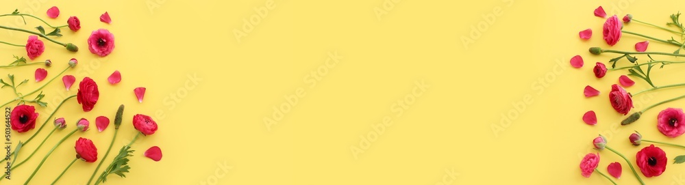 Top view image of pink flowers composition over yellow background