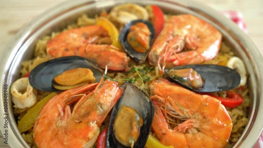 Seafood Paella with prawns, clams, mussels on saffron rice - Spanish food style Seafood Paella with prawns, clams, mussels on saffron rice - Spanish food style