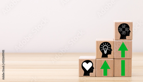 Skills development concept. New skills for technology evolution. Soft, thinking,digital skill. Hand holds wooden cubes with digital skill icon on white background, copy space. Reskilling, upskilling. photo