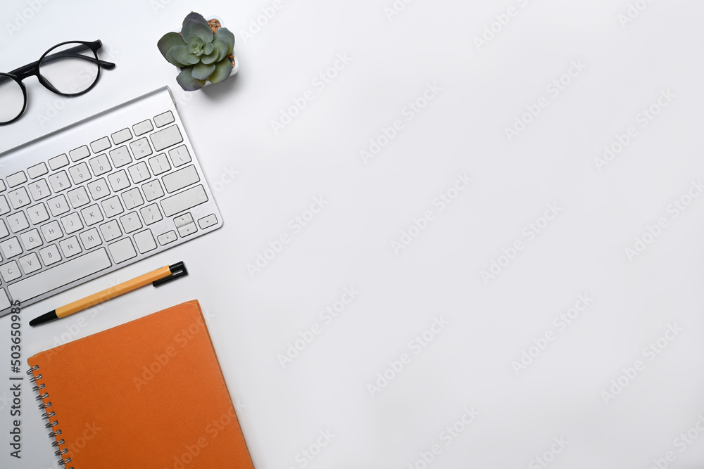 Flat lay, wireless keyboard, glasses and notebook on white background. - obrazy, fototapety, plakaty 