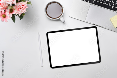 Mock up digital tablet, notepad, stylus pen and wireless on white office desk.