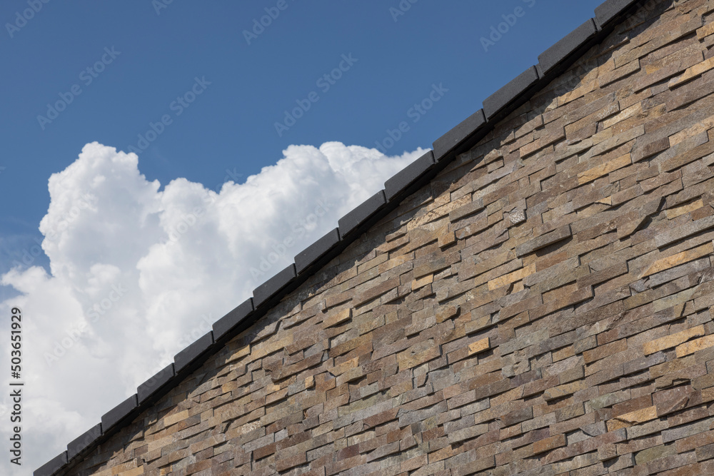 modern architecture detail, stone brick with sky