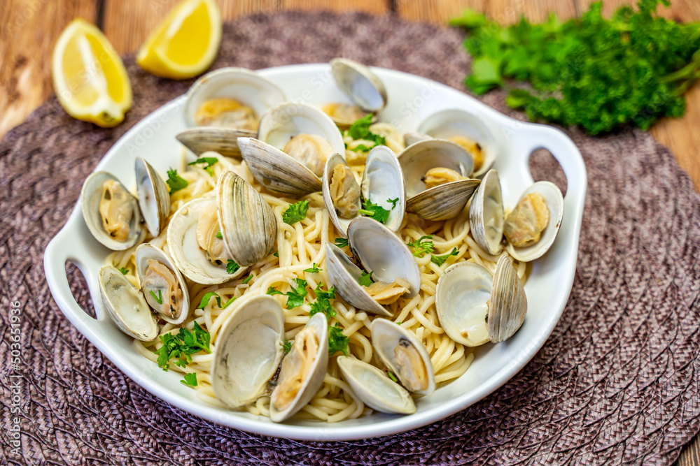 Little Neck Clams with pasta on a white plate. Pasta with clams. 