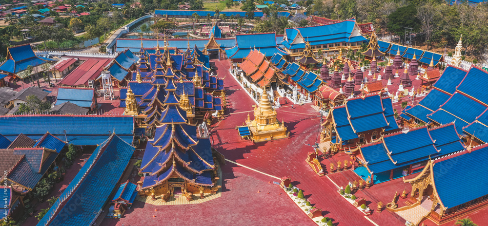Obraz premium Aerial view of Wat Phiphat Mongkhon blue temple in Sukhothai, Thailand