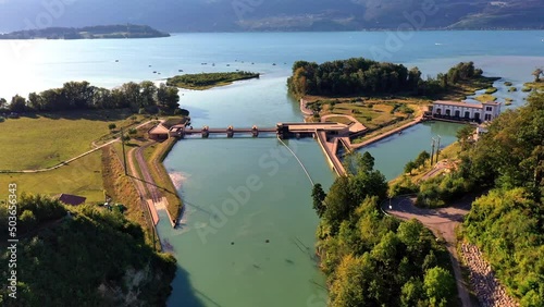 The Hagneck hydroelectric power plant on Lake Biel in Switzerland - beautifully located, and renatured. Green electricity is produced here! After the weir comes directly a nature reserve for birds. photo