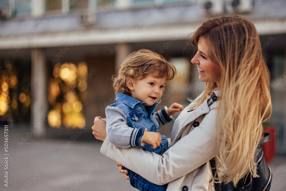 Fototapeta premium Mother and son spend the day outdoor, in a hug.