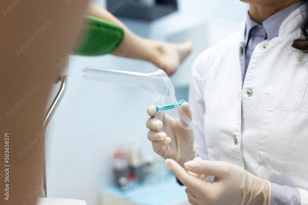 Treatment of cervical disease. Female gynecologist woman patient in gynecological chair during