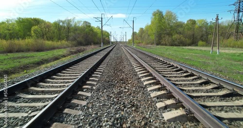 Span between railroad tracks. Empty straight two-way railways at summer sunny day. Between two railroad tracks. Railway track