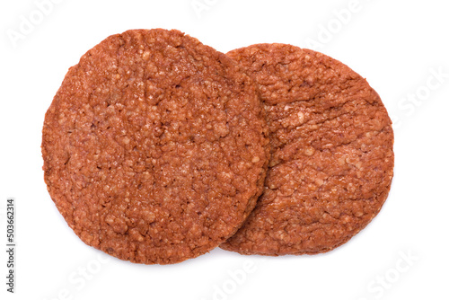 Two breaded chicken burger patties, intermediate good food, isolated on white background top view flat lay