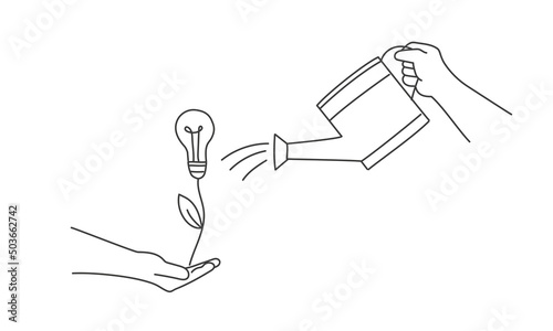 Human hand is watering a growing bright light bulb plant.