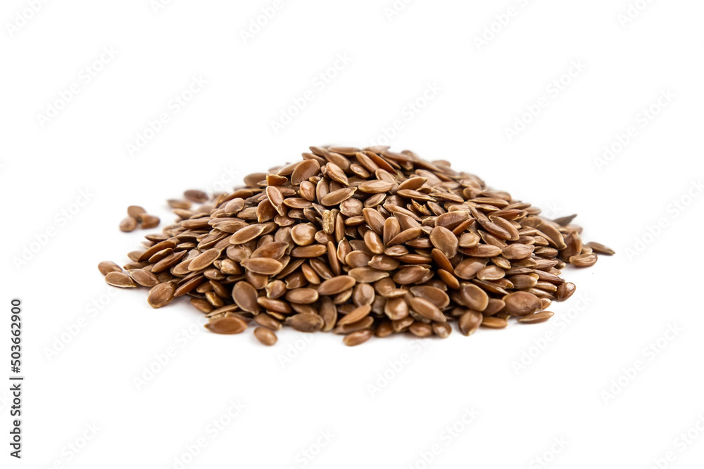 Flax seeds in a pile on a white background Flax seeds in a pile on a white background