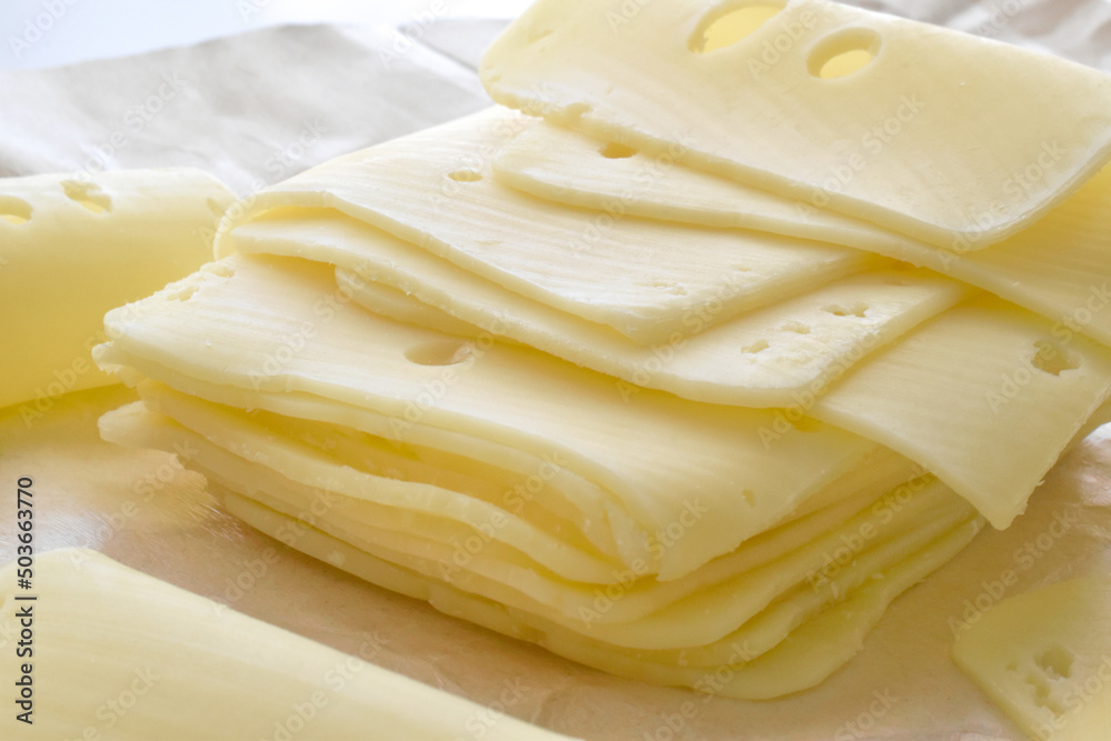 Cheese slices on brown paper. Cheese slices on brown paper.