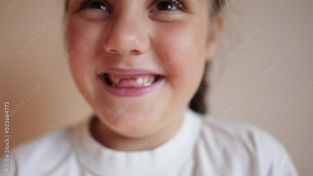little girl smiling. portrait child girl daughter a close up lifestyle looking at camera smiling indoors. happy family kid dream concept. baby close up smile little girl smiling. portrait child girl daughter a close up lifestyle looking at camera smiling indoors. happy family kid dream concept. baby close up smile