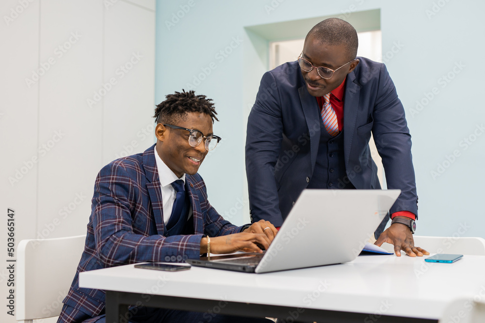 working african business people in office with laptop working african business people in office with laptop