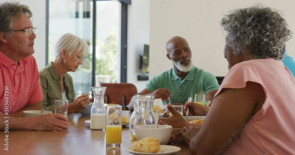 Happy senior diverse people having breakfast at retirement home Happy senior diverse people having breakfast at retirement home