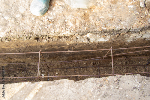 an iron structure is placed in the ground in the trench