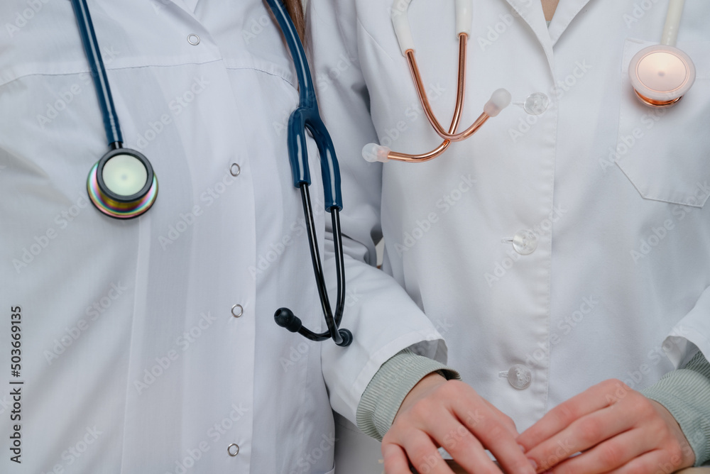 Medical stethoscope.White and blue stethoscopes..Doctors with stethoscopes.Doctors holding stethoscopes Medical stethoscope.White and blue stethoscopes..Doctors with stethoscopes.Doctors holding stethoscopes
