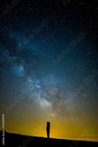 Milky way and girl in Serra Del Montsec, Lleida, Spain