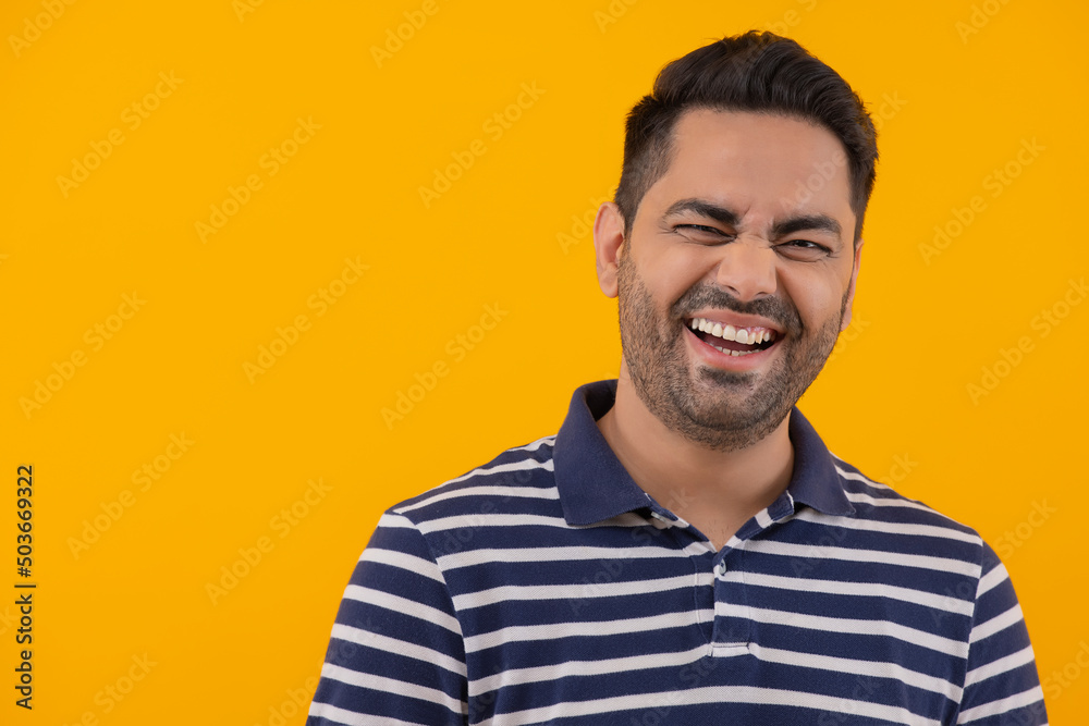 Portrait of smiling young man against yellow background Portrait of smiling young man against yellow background