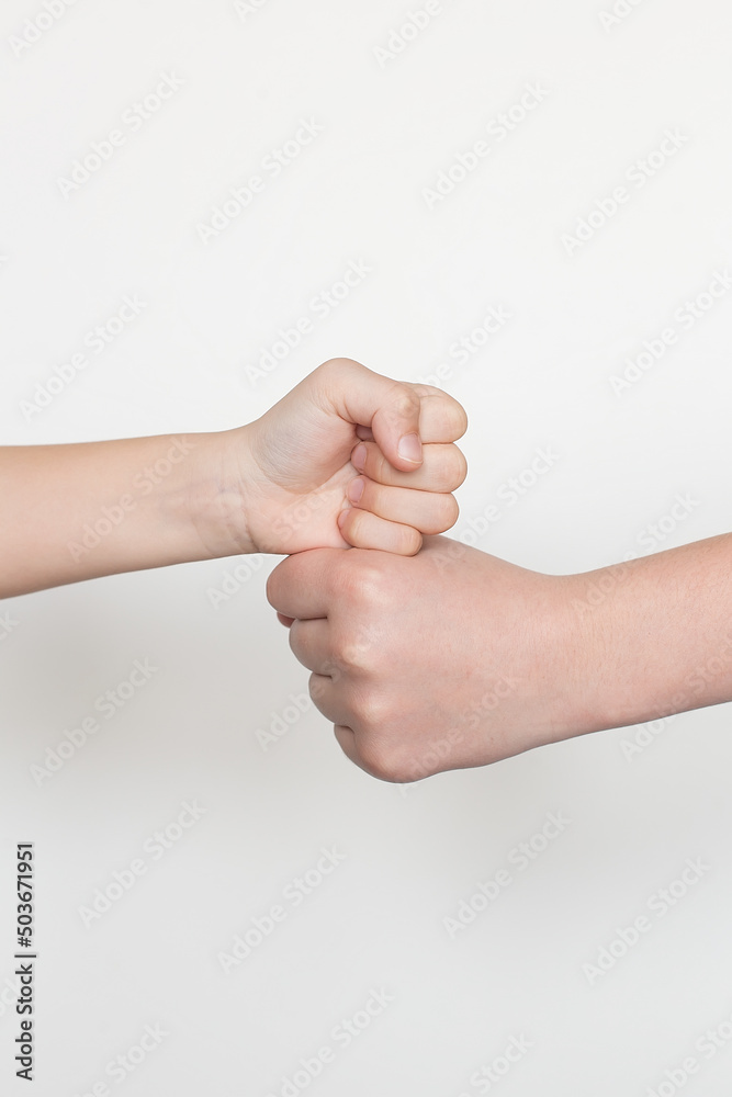 Children's hands gesticulating on a white background. Male greeting. Children's hands gesticulating on a white background. Male greeting.