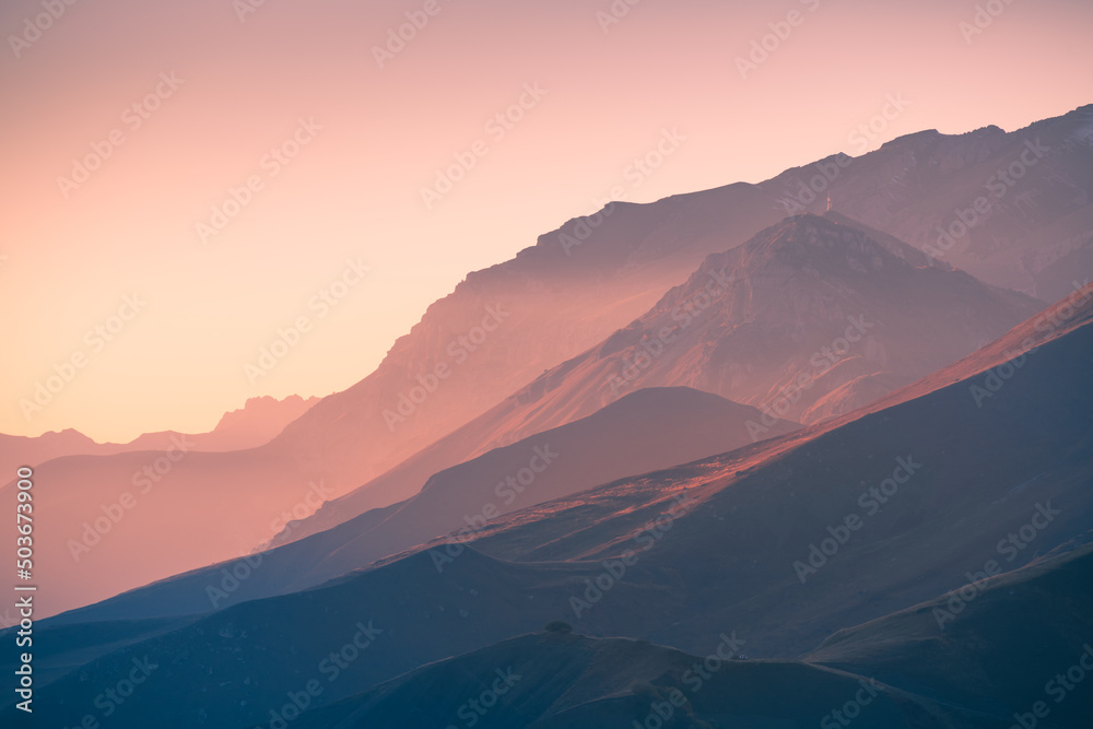 Beautiful mountains at sunset. Autumn landscape, abstract nature background. Ingushetia, North Caucasus, Russia. - obrazy, fototapety, plakaty 