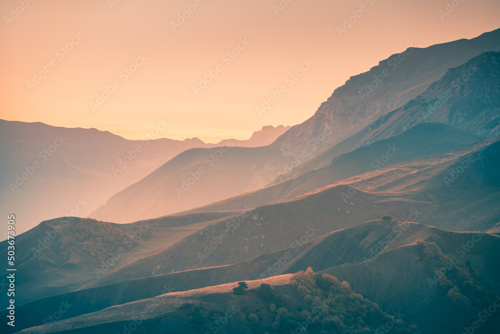 Beautiful mountains at sunset. Autumn landscape, nature background. Ingushetia, North Caucasus, Russia.