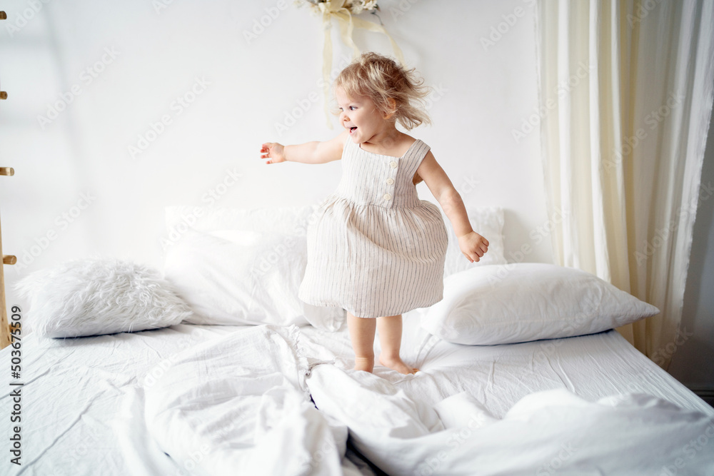 Happy childhood a little girl in an apartment playing Happy childhood a little girl in an apartment playing