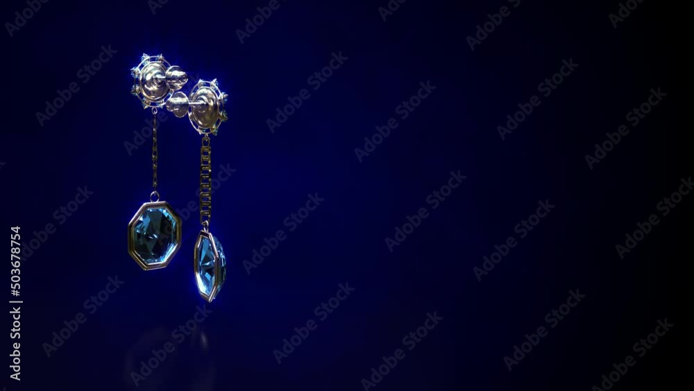 Shining golden eardrops with blue topaz jewels rotate, fictive - loop video