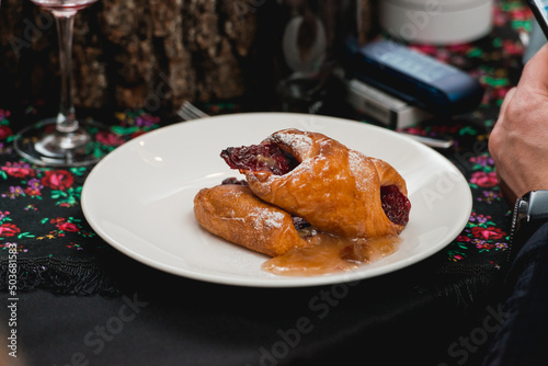 flying buns with fruits on a white plate