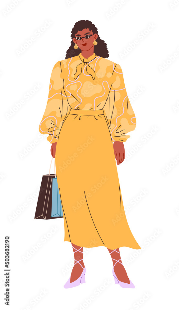 Woman in glasses, yellow blouse, and skirt with bags from shop