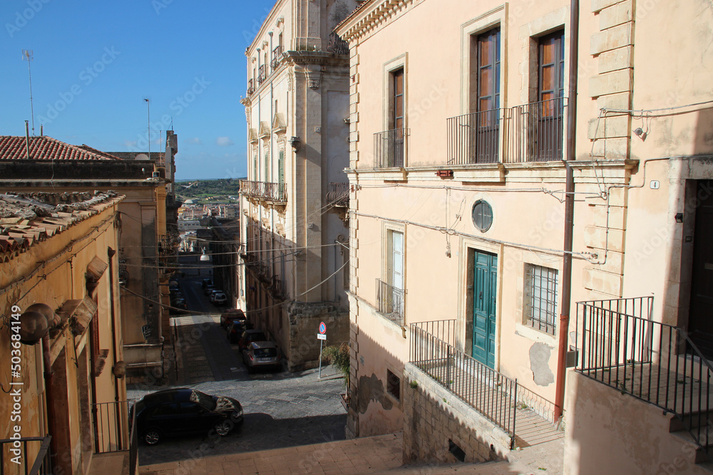 street and flat buildings in noto in sicily (italy)