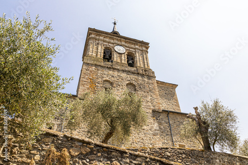 Clock tower of the Church of Saint Nicholas of Bari in Molinaseca, Leon, Spain photo