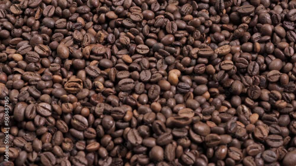 Dark roast coffee beans background, top view