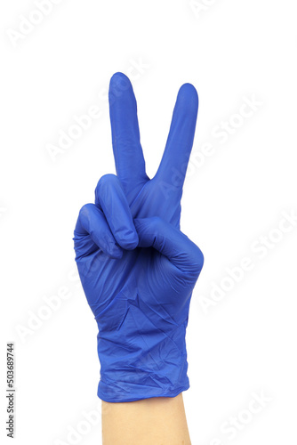 hand in blue medical glove showing two fingers victory gesture on white background