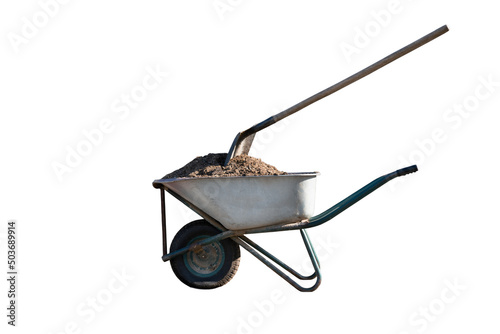 wheelbarrow with sand and shovel on white background photo