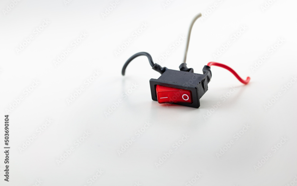 Power down or power OFF. Red switch with red black and white cable legs falling down. Switch in Power down or power OFF. Red switch with red black and white cable legs falling down. Switch in