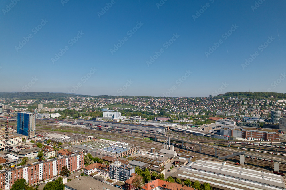 Aerial view of City of Zürich on a sunny spring day with blue cloudy sky background. Photo taken April 28th, 2022, Zurich, Switzerland. Aerial view of City of Zürich on a sunny spring day with blue cloudy sky background. Photo taken April 28th, 2022, Zurich, Switzerland.