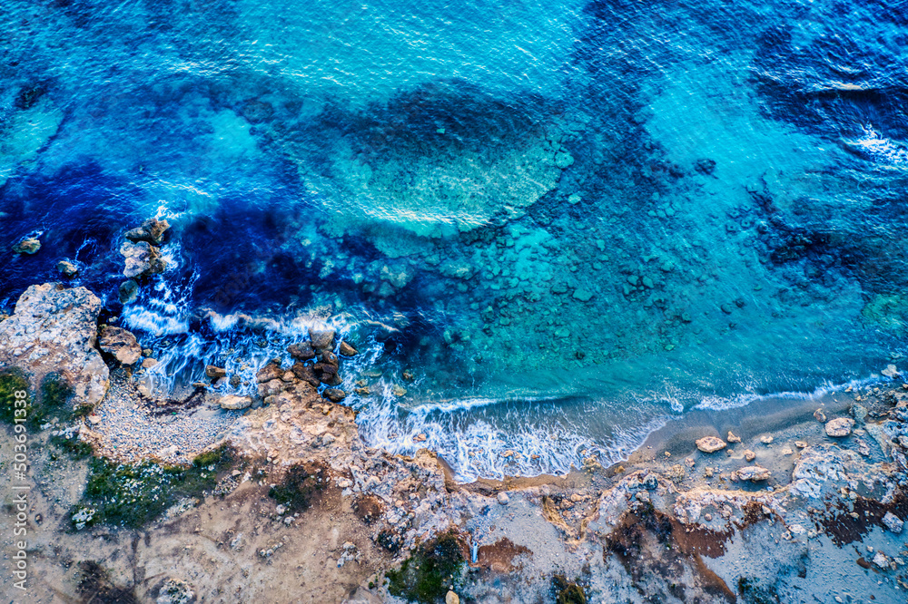 Rocky coast blue sea in Apulia, Salento, Italy