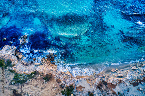 Rocky coast blue sea in Apulia, Salento, Italy © Andrea Carro