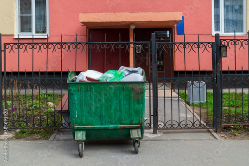 dumpsters near a residential building