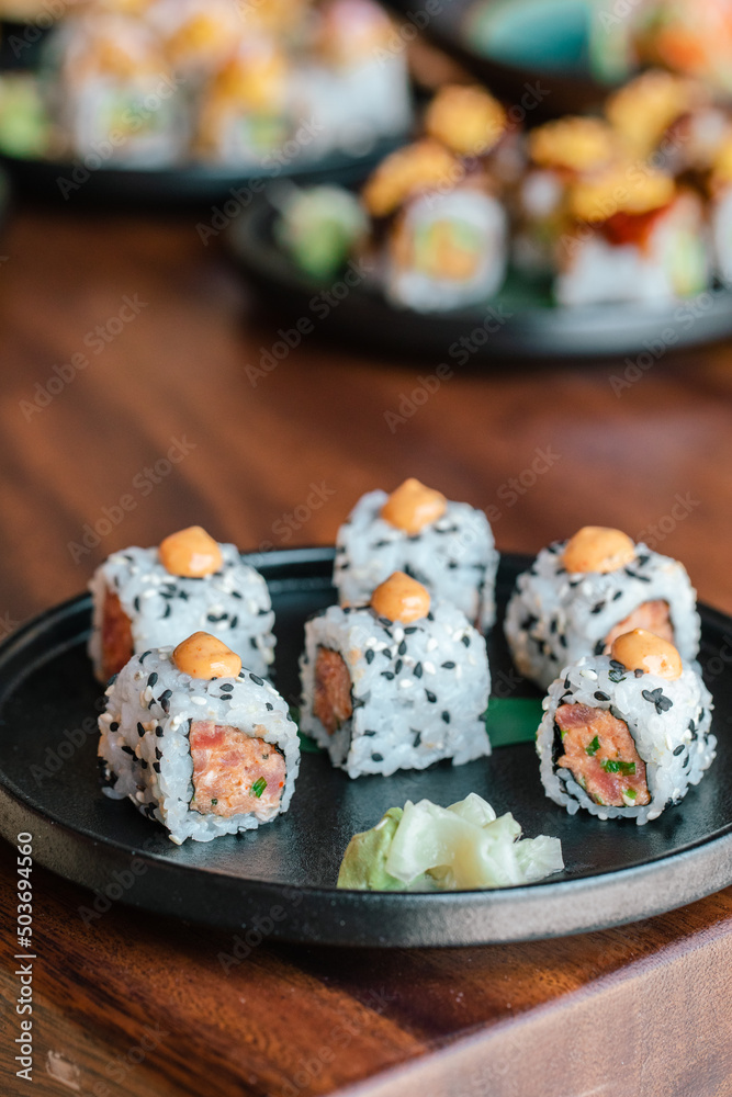 Sushi lifestyle images on the table using a chopstick Sushi lifestyle images on the table using a chopstick