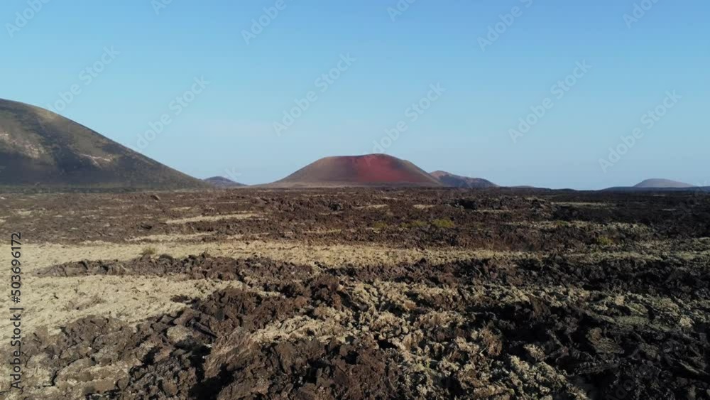 Volcanic landscape of Lanzarote island with rough terrain, aerial drone view Volcanic landscape of Lanzarote island with rough terrain, aerial drone view