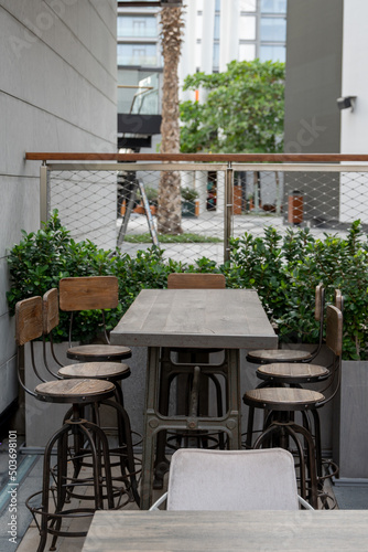 Restaurant seating outside with rugged chairs and tables