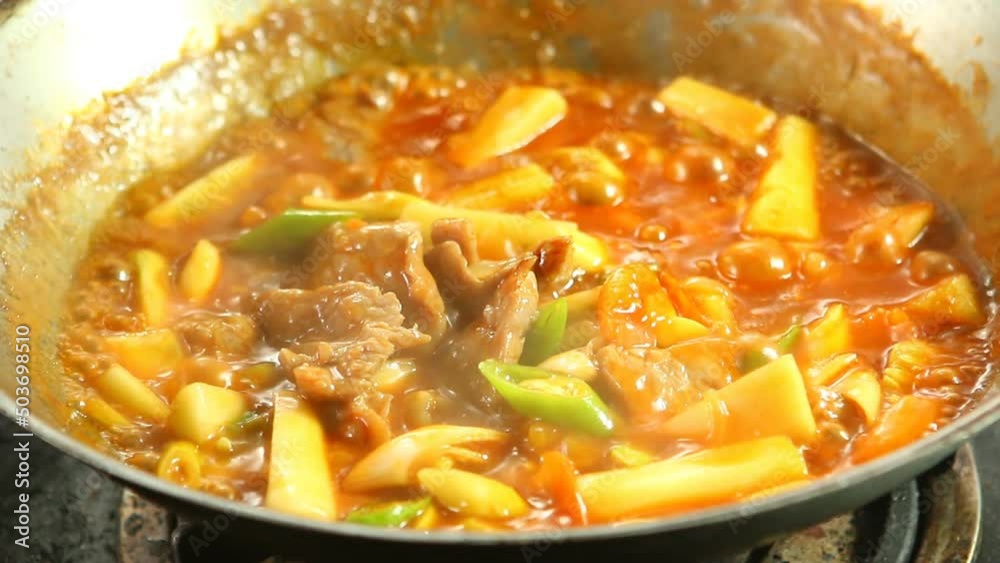 cooking fried Stir Sweet and sour sauce with Vegetable and Pork, Thai famous food. cooking fried Stir Sweet and sour sauce with Vegetable and Pork, Thai famous food.