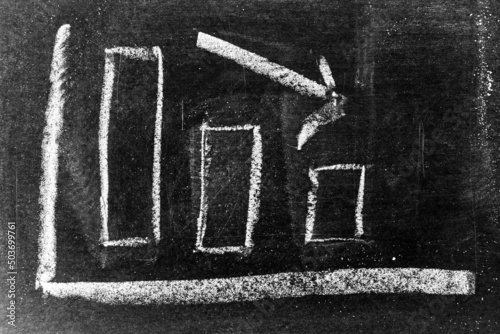 White chalk hand drawing in arrow down shape on blackboard or chalkboard background (Concept of stock decline, down trend of business, economy)