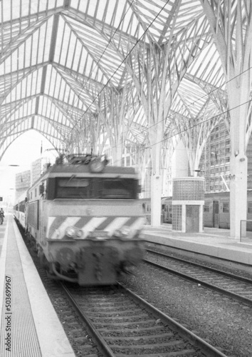 Grayscale of a train in the Gare do Oriente station in Lisbon, Portugal photo